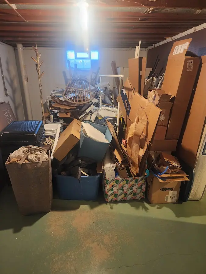 Roll-off dumpster container at job site for Yard Waste Dumpster Rental in Saco